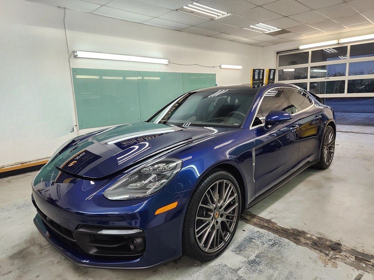 Vehicle inside a detail shop bay